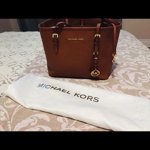 A brown MK bag